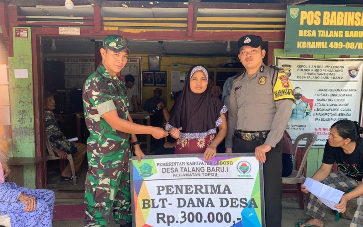 Bhabinkamtibmas Polsek Rimbo Pengadang Hadiri Penyaluran BLT DD Desa Talang Baru I