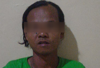Tersangka MA saat diamankan polisi