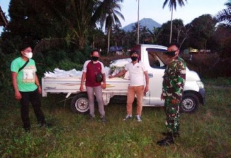 Babinsa Koramil Dimembe Dampingi Penyaluran Bibit Jagung
