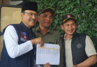 Mensos Saifullah Yusuf saat menunjukkan data 