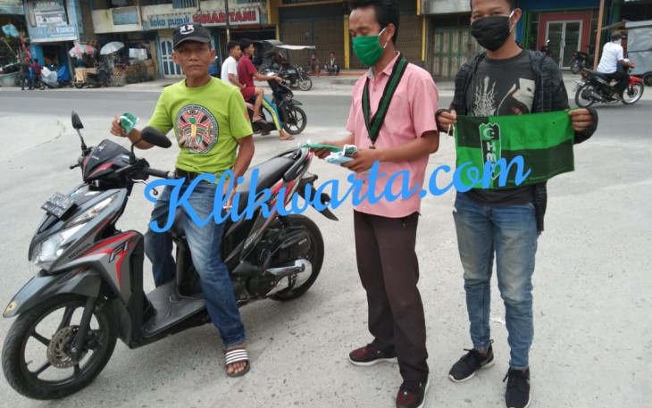 HMI Komisariat STAI Pancabudi Berbagi Masker ke Masyarakat