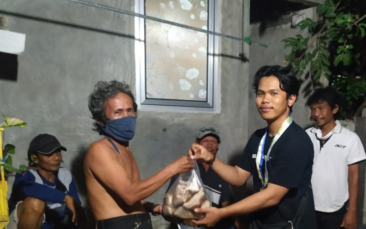 PMII Jakarta Utara Bagikan Ratusan Nasi Bungkus untuk Pekerja Informal