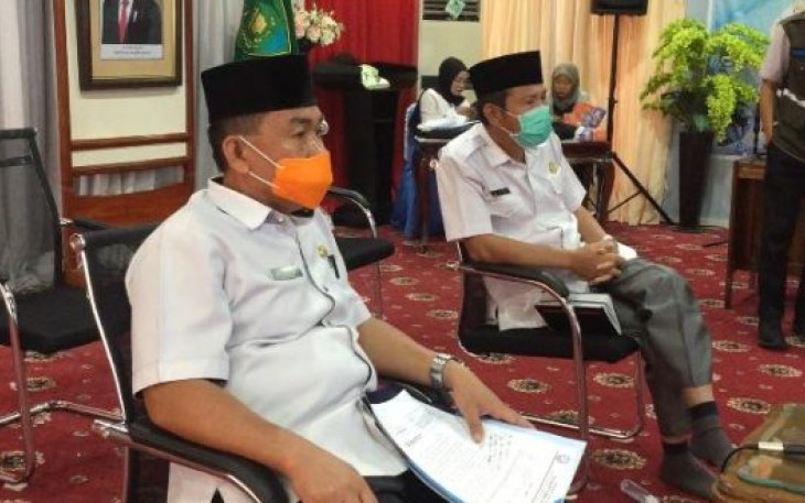 Asisten III M Husni Saat Mengikuti Rakor  Penanganan Dampak Virus Corona 