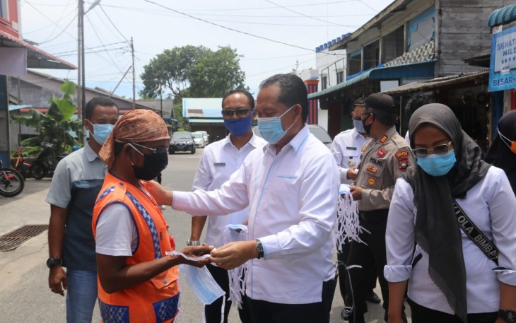 Buralimar Turun Bagikan Masker