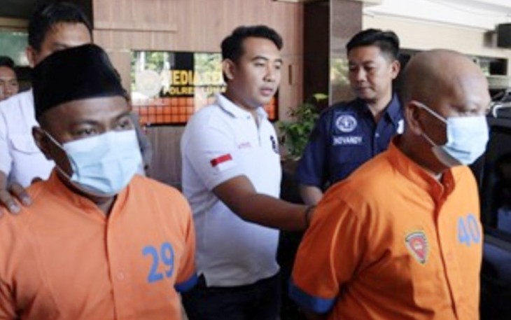 Tersangka GS dan IF digelandang polisi terkait kepengurusan PTSL