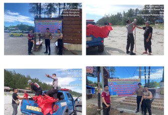 Personel Sat Samapta Polresta Bengkulu dan Personel Tagana Dinsos Kota Bengkulu Pasang Patok Larangan Mandi di Sepanjang Pantai Panjang 