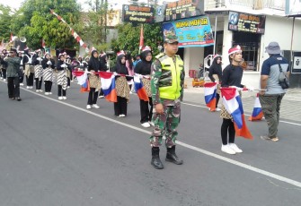 Babinsa Koramil Widodaren Amankan Pawai Budaya HUT Kemerdekaan RI Ke 80