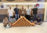 Tersangka (duduk diborgol) saat diamankan petugas