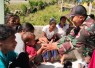 Yonarmed 12 Kostrad Gelar Posyandu dan Bagikan Bubur Kacang Hijau